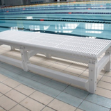 Tali Sport white foldable swimming pool platform with a slatted surface for water flow, placed on a pool deck. 