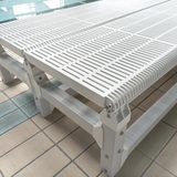 Tali Sport white foldable swimming pool platform with a slatted surface for water flow, used for swim training. 