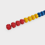 Tali Sport swimming pool lane rope with red, yellow, and blue hexagonal polyethylene floats for wave reduction 
