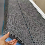 Tali Sport grey modular non-slip PVC pool mat with a textured pebble design for showers and changing rooms 